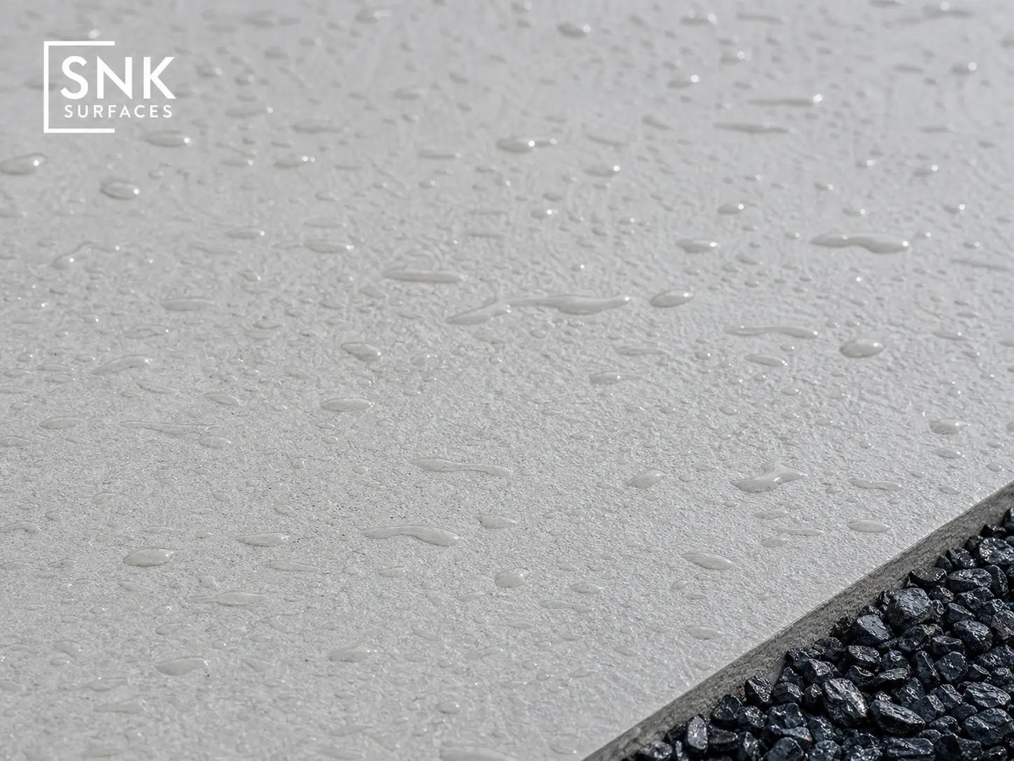 Close-up showing R11 slip-resistant textured surface on wet Quartz White Porcelain Paving