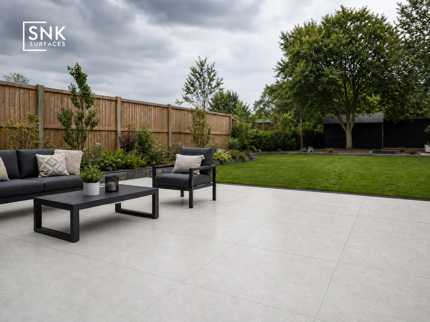 Modern UK patio laid with Quartz White Porcelain Paving reflecting natural sunlight