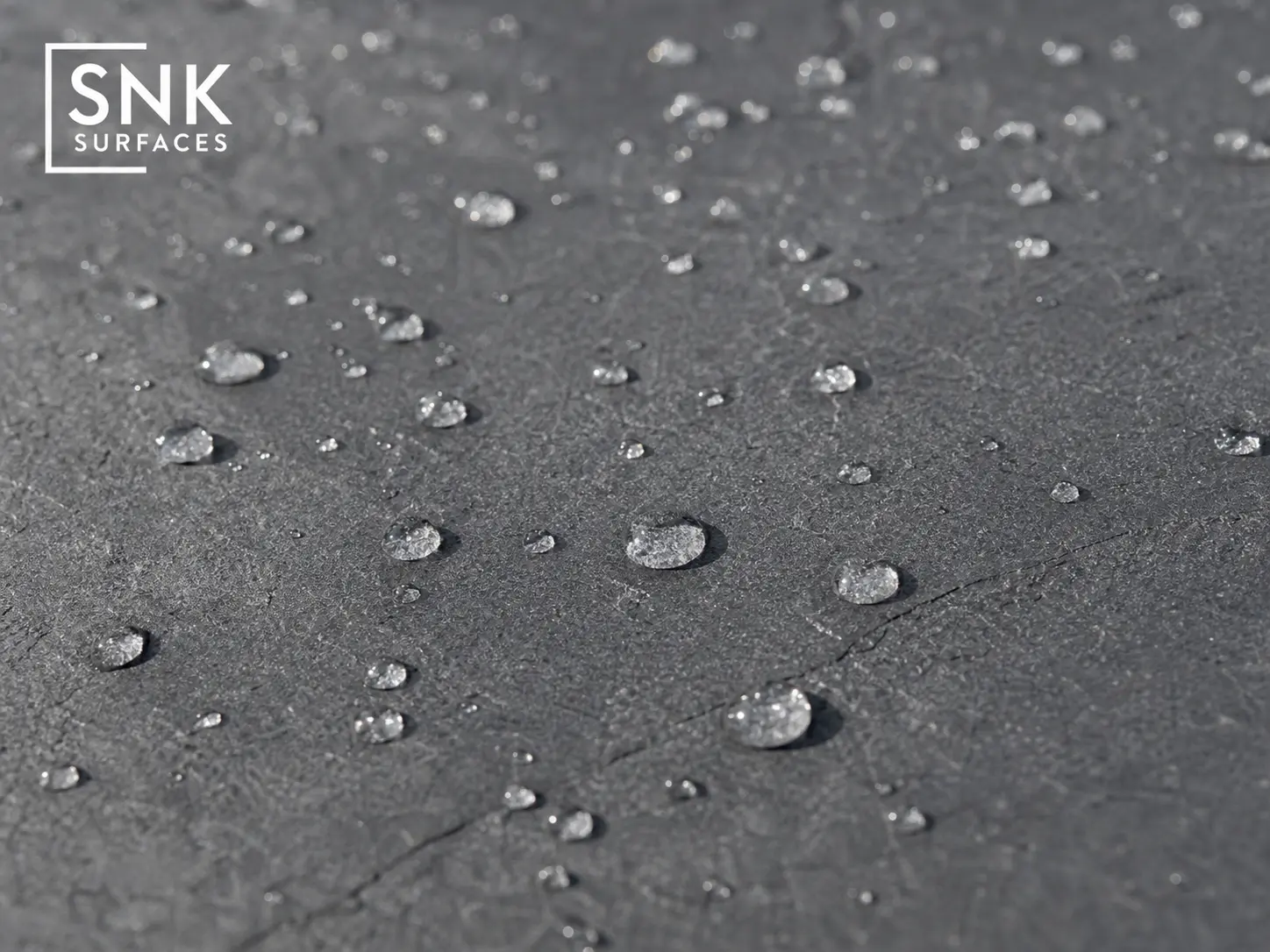 Water beading on sealed Sagar Black Sandstone surface showing effective moisture protection