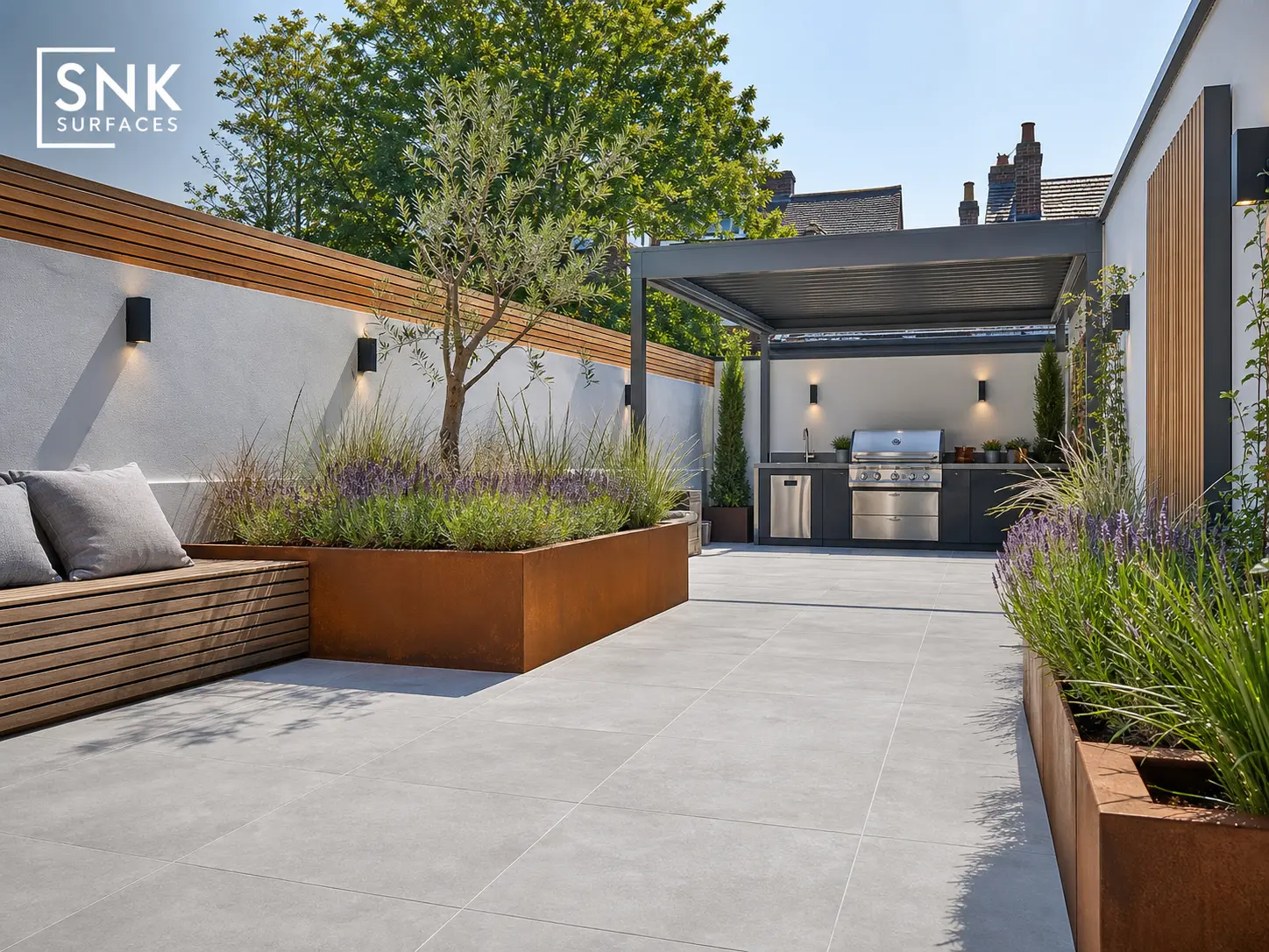 Completed contemporary UK garden featuring seamless silver grey kandla grey porcelain paving with ultra-tight joints