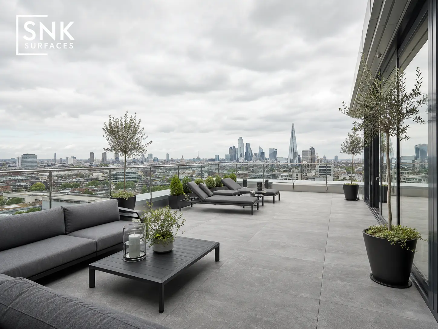 Modern London roof terrace fitted with silver grey porcelain paving slabs on adjustable pedestal supports